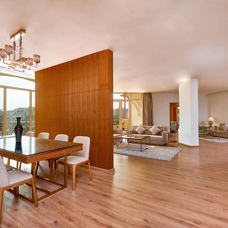 Moevenpick Hotel Cairo - Media City Giza Екстериор снимка A 3D rendering of a living room